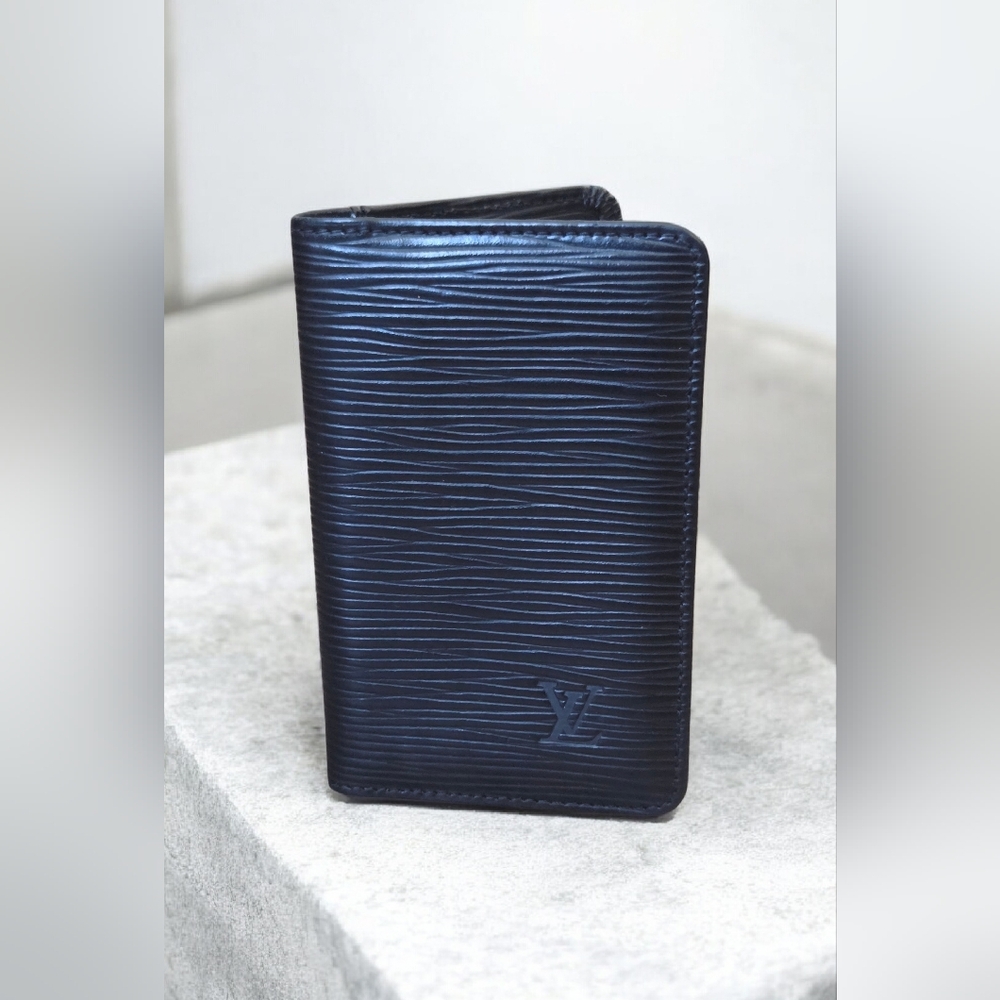 Louis Vuitton card case in Black Epi leather.